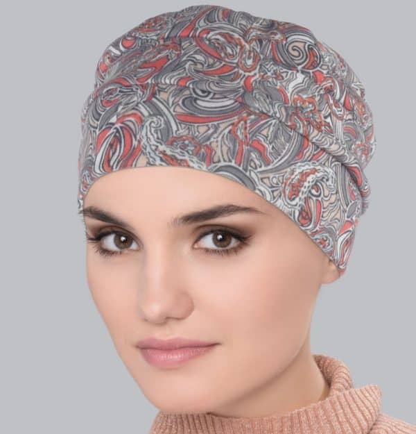 Woman wearing a comfortable Tala Turban Flora Taupe with floral design.