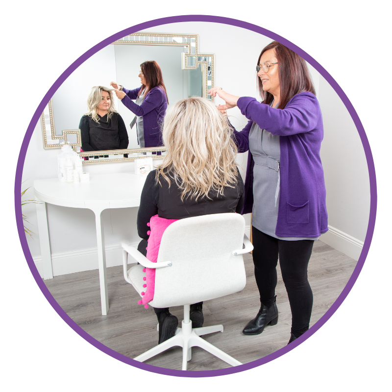 A lady having a wig fitted for hair loss or cancer treatment