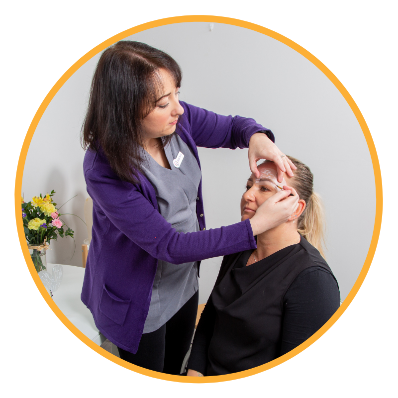 A lady applying eyebrows to another lad using organic eyebrow makeup