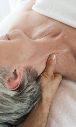 A lady having an oncology massage during cancer treratment. Using cold cap treatment